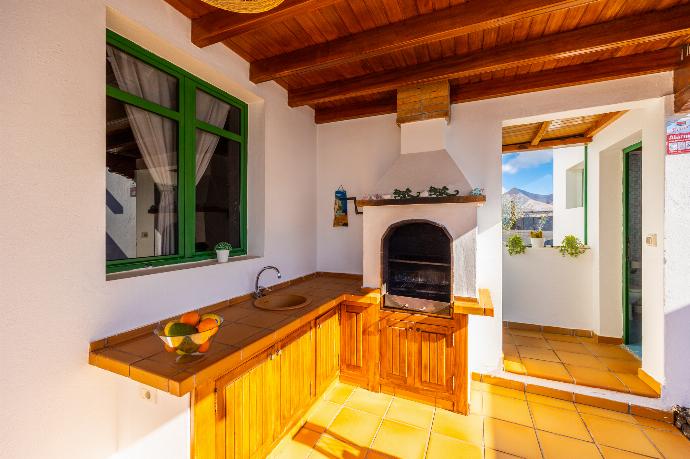 Sheltered terrace area with BBQ . - Villa Sol y Mar . (Photo Gallery) }}