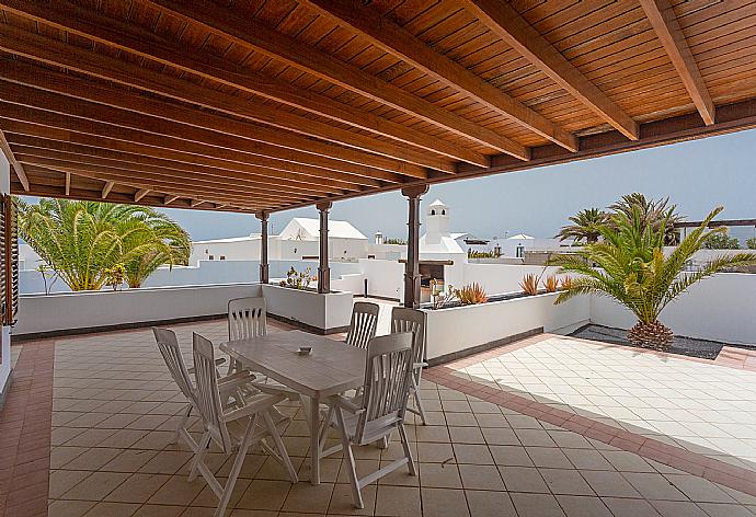 Upper terrace with outdoor dining area . - Villa Dorada . (Photo Gallery) }}