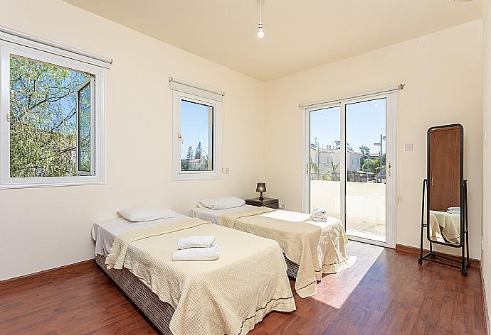 Twin bedroom with A/C and balcony access . - Villa Chryso . (Photo Gallery) }}