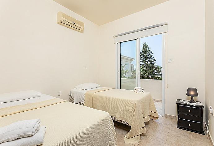 Twin bedroom with A/C and balcony access . - Villa Nikol . (Photo Gallery) }}