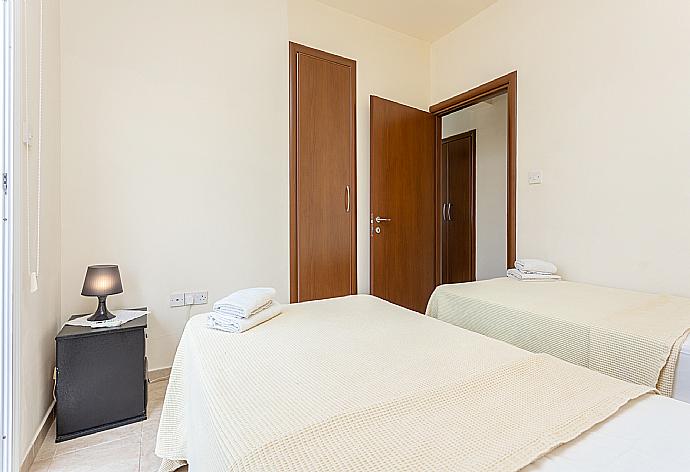 Twin bedroom with A/C and balcony access . - Villa Nikol . (Galleria fotografica) }}