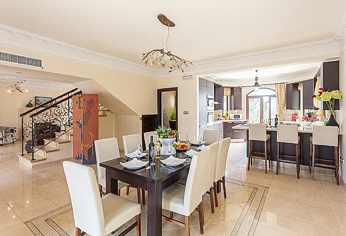 Open-plan living room with sofas, dining area, kitchen, ornamental fireplace, A/C, WiFi internet, and satellite TV . - Villa  Elysia . (Photo Gallery) }}