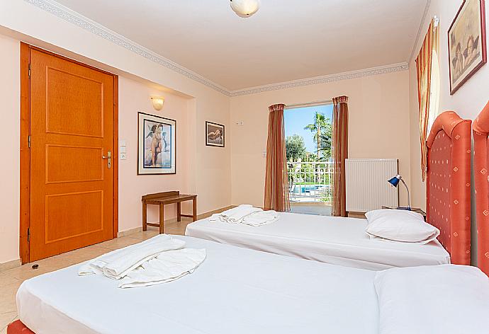 Twin bedroom with A/C and terrace access . - Villa Astro . (Photo Gallery) }}