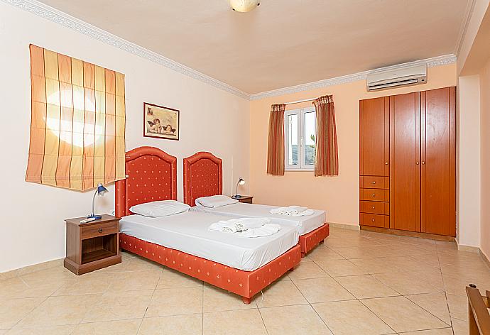 Twin bedroom with A/C and terrace access . - Villa Astro . (Photo Gallery) }}