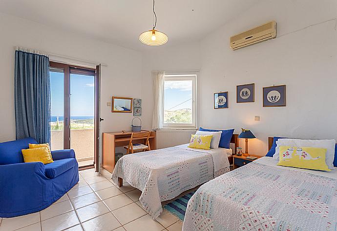 Twin bedroom on first floor with A/C and balcony access . - Villa Armi . (Photo Gallery) }}