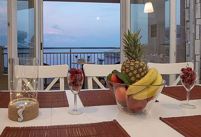 Dining room with A/C and balcony access with panoramic sea views . - Villa Bacante . (Photo Gallery) }}