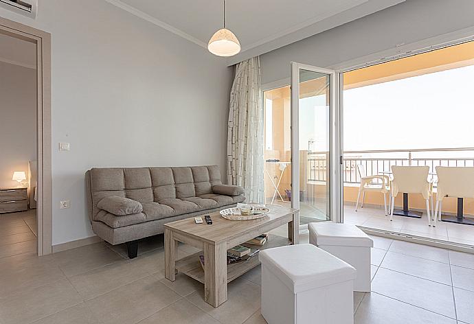 Open-plan living room with dining area, kitchen, A/C, WiFi internet, satellite TV, and terrace and balcony access . - Villa Aurora . (Photo Gallery) }}