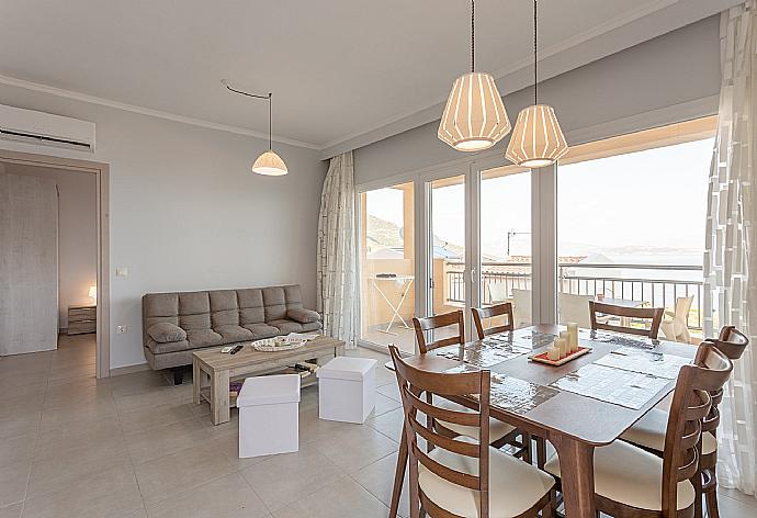 Open-plan living room with dining area, kitchen, A/C, WiFi internet, satellite TV, and terrace and balcony access . - Villa Aurora . (Photo Gallery) }}