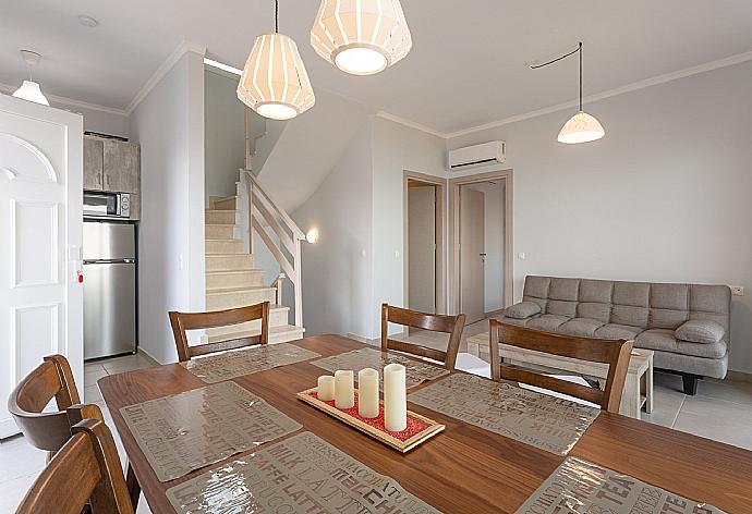 Open-plan living room with dining area, kitchen, A/C, WiFi internet, satellite TV, and terrace and balcony access . - Villa Aurora . (Photo Gallery) }}