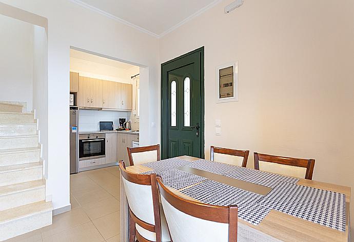 Open-plan living room with dining area, kitchen, A/C, WiFi internet, satellite TV, and balcony access with sea views  . - Villa Sequoia Yellow . (Photo Gallery) }}