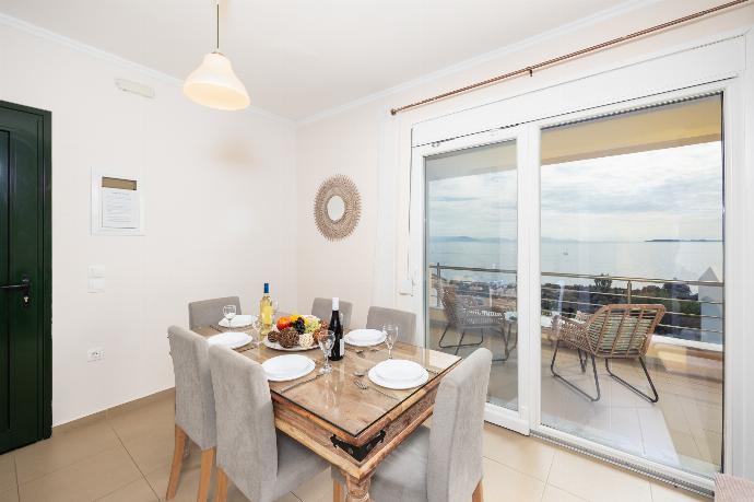 Open-plan living room with sofa, dining area, kitchen, A/C, WiFi internet, satellite TV, and sea views . - Villa Sequoia Yellow . (Photo Gallery) }}