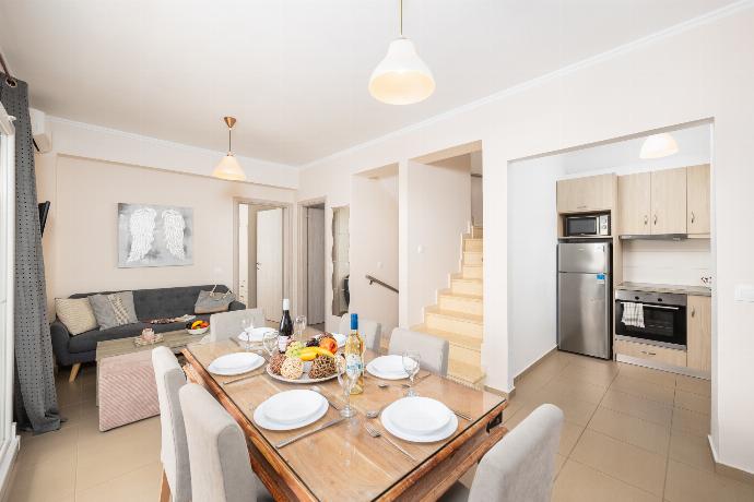 Open-plan living room with sofa, dining area, kitchen, A/C, WiFi internet, satellite TV, and sea views . - Villa Sequoia Yellow . (Photo Gallery) }}