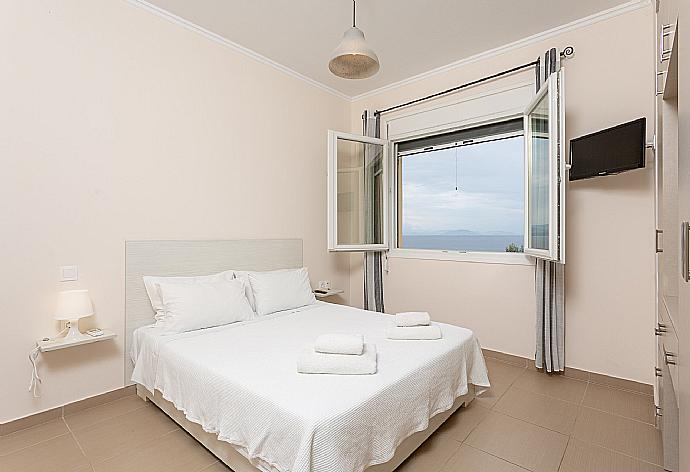 Double bedroom on first floor with A/C and TV . - Villa Alya . (Photo Gallery) }}