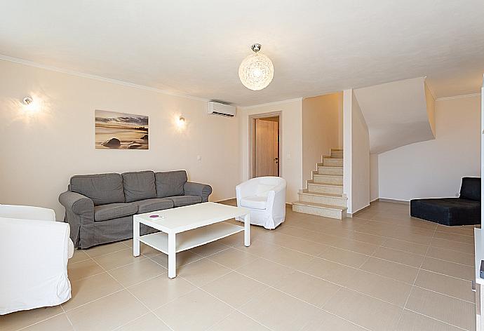 Living room on ground floor with A/C, WiFi Internet, and Satellite TV  . - Villa Alya . (Galería de imágenes) }}