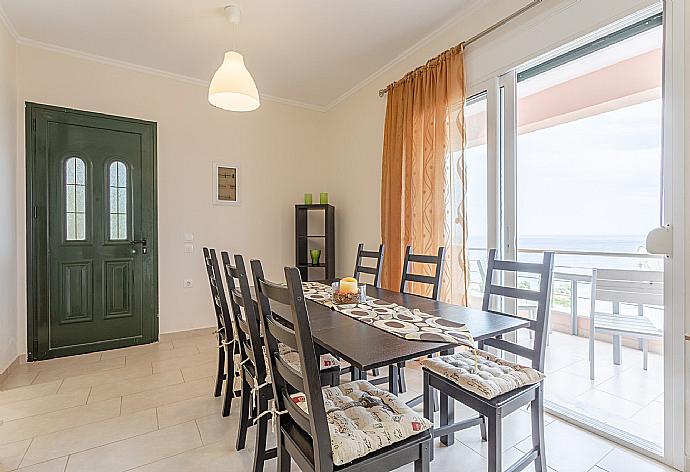 Dining room with A/C and balcony access with sea views . - Villa Situla . (Photo Gallery) }}
