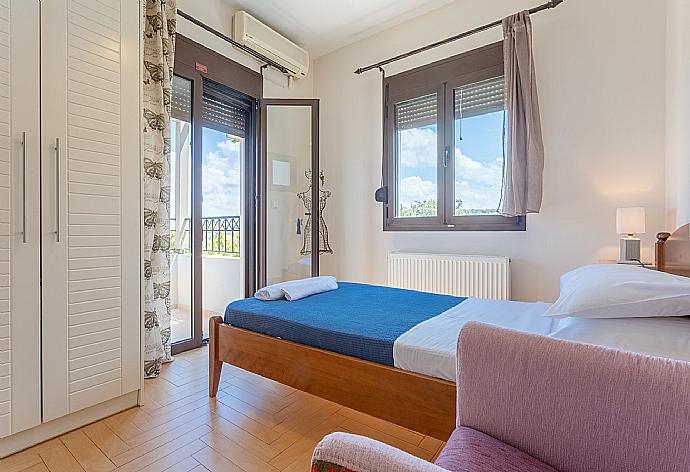 Single bedroom with A/C and balcony access with sea views . - Villa Simela . (Photo Gallery) }}