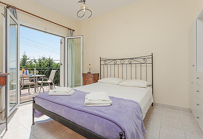 Double bedroom on first floor with A/C and balcony access . - Skala Villa Blue . (Галерея фотографий) }}