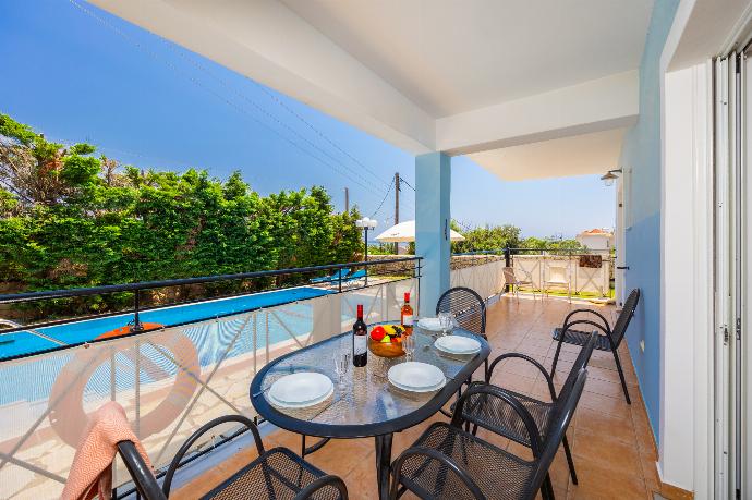 Sheltered terrace area . - Skala Villa Blue . (Photo Gallery) }}
