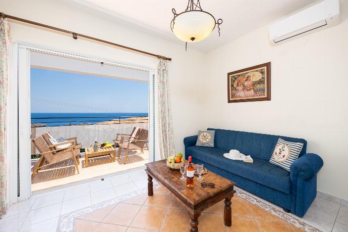 Living room with sofas, A/C, WiFi internet, and sea views . - Skala Villa Yellow . (Photo Gallery) }}