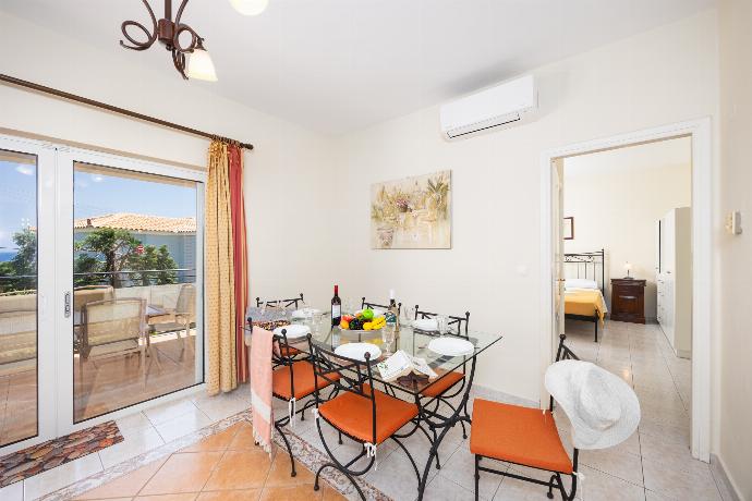 Dining room with kitchen, A/C, WiFi internet, and satellite TV . - Skala Villa Yellow . (Photo Gallery) }}