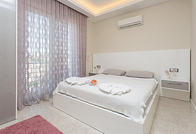 Double bedroom with A/C and TV . - Villa Nirvana . (Photo Gallery) }}