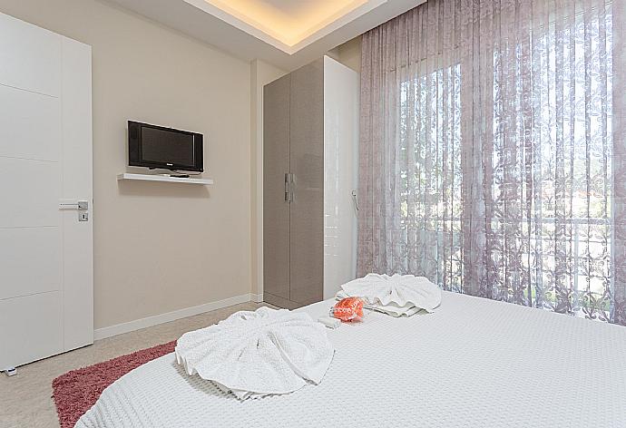 Double bedroom with A/C and TV . - Villa Nirvana . (Photo Gallery) }}