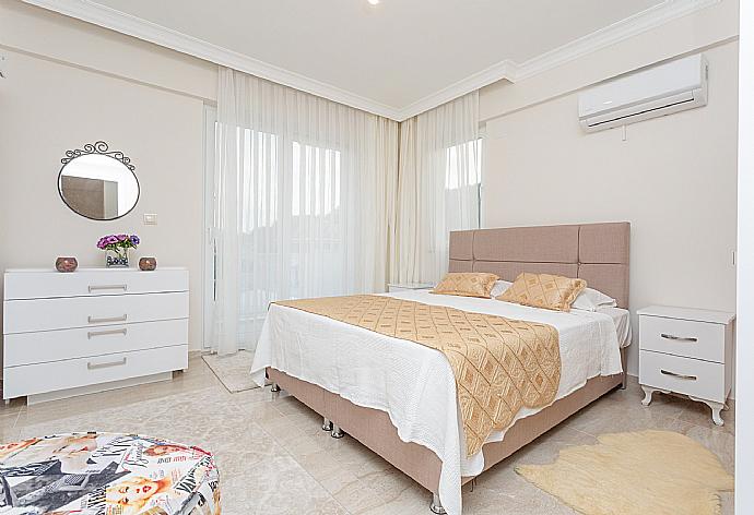 Double bedroom with en suite bathroom, A/C, and balcony access . - Villa Mina . (Photo Gallery) }}