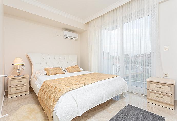 Double bedroom with en suite bathroom, A/C, and balcony access . - Villa Mina . (Photo Gallery) }}