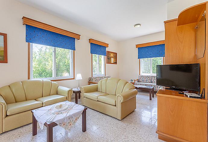 Open-plan living room with dining area, kitchen, WiFi Internet, TV and DVD player, and terrace access . - Villa Aristotelis . (Photo Gallery) }}