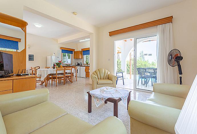 Open-plan living room with dining area, kitchen, WiFi Internet, TV and DVD player, and terrace access . - Villa Aristotelis . (Photo Gallery) }}