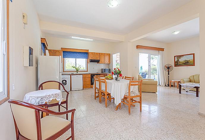Open-plan living room with dining area, kitchen, WiFi Internet, TV and DVD player, and terrace access . - Villa Aristotelis . (Photo Gallery) }}