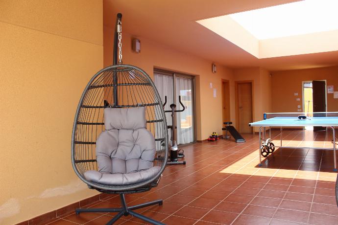 Ping pong table, gym area and swing chairs . - Villa Domingo . (Photo Gallery) }}