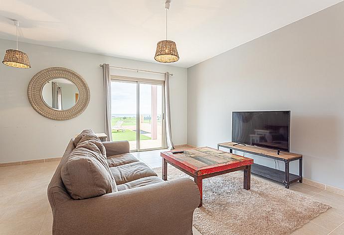 Living room with sofas, dining area, WiFi internet, satellite TV, and pool terrace access . - Villa Domingo . (Galerie de photos) }}