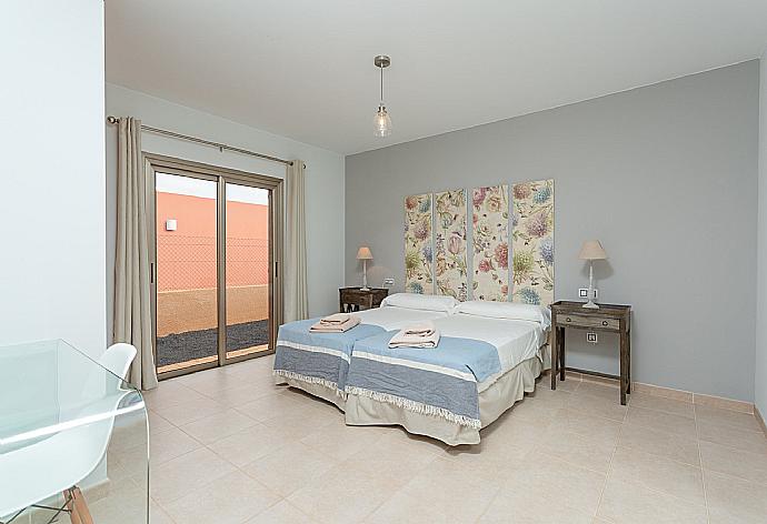 Twin bedroom with terrace access . - Villa Barquetta . (Photo Gallery) }}