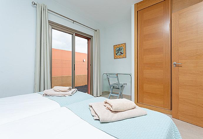 Twin bedroom with terrace access . - Villa Barquetta . (Photo Gallery) }}