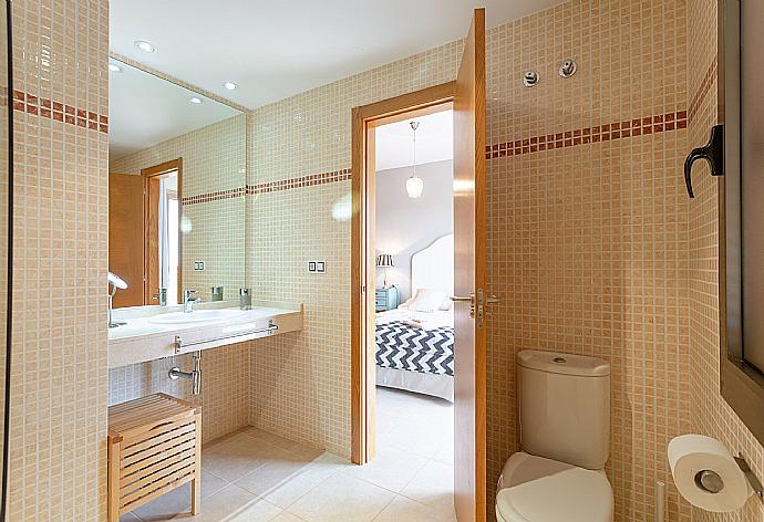 En suite bathroom with bath and shower . - Villa Tahiche . (Photo Gallery) }}
