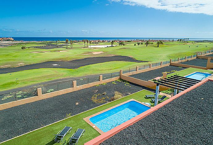 Aerial view of pool terrace with sea views . - Villa Marisol . (Photo Gallery) }}