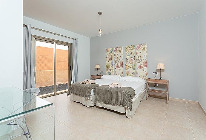Twin bedroom with terrace access . - Villa Tamarindos . (Photo Gallery) }}