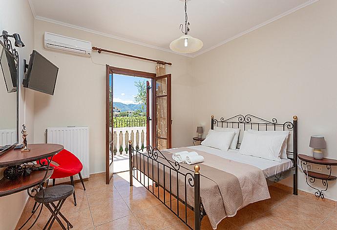 Double bedroom with A/C, TV, and terrace access . - Villa Rose . (Photo Gallery) }}