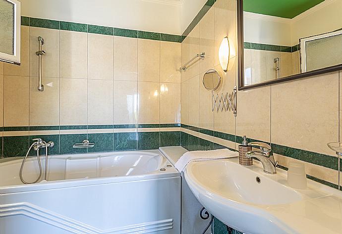 En suite bathroom with bath and shower . - Villa Votsalo . (Photo Gallery) }}