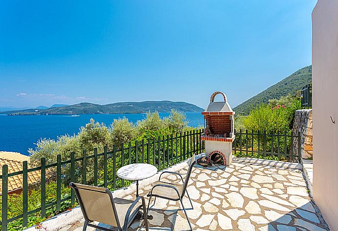 Private terrace area with BBQ and panoramic sea views . - Villa Akrogiali . (Photo Gallery) }}