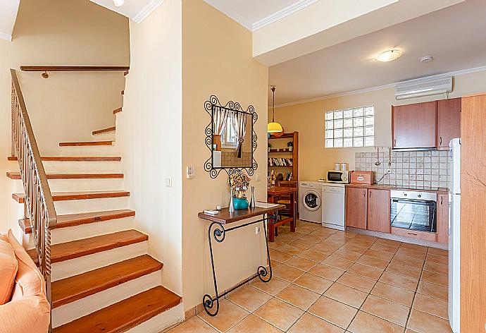 Open-plan living room with sofas, dining area, kitchen, ornamental fireplace, A/C, WiFi internet, satellite TV, and terrace access with panoramic sea views . - Villa Thalassa . (Galleria fotografica) }}