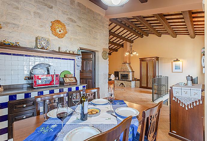 Dining area and equipped kitchen . - Villa Aziz . (Photo Gallery) }}