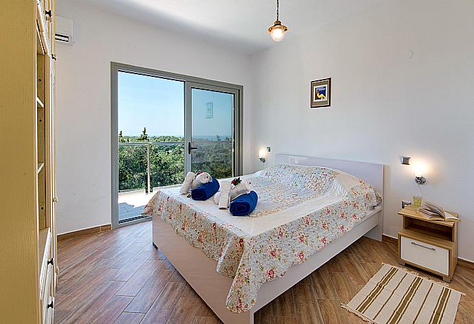 Double bedroom with terrace access and beautiful view . - Villa Stephania . (Photo Gallery) }}