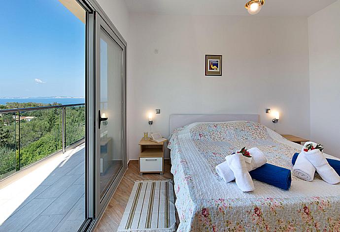 Double bedroom with terrace access and beautiful view  . - Villa Stephania . (Photo Gallery) }}