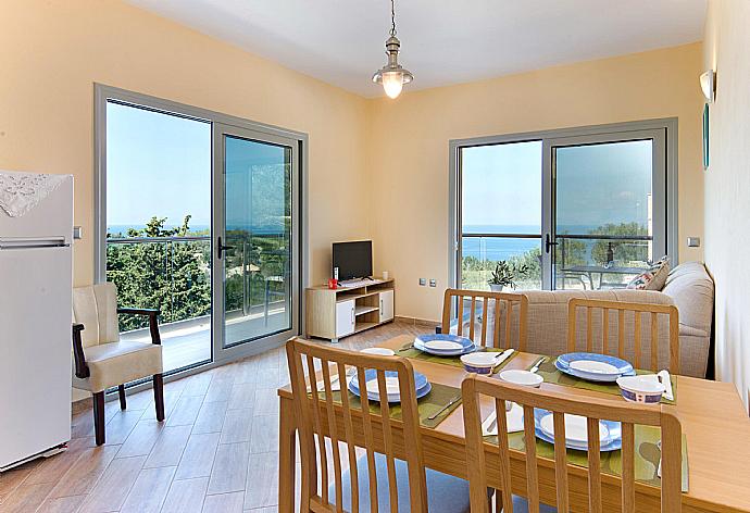 Dining area with terrace access and beautiful view . - Villa Stephania . (Photo Gallery) }}