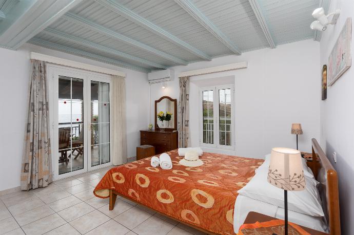 Double bedroom with A/C, sea views, and balcony access . - Fotini . (Photo Gallery) }}