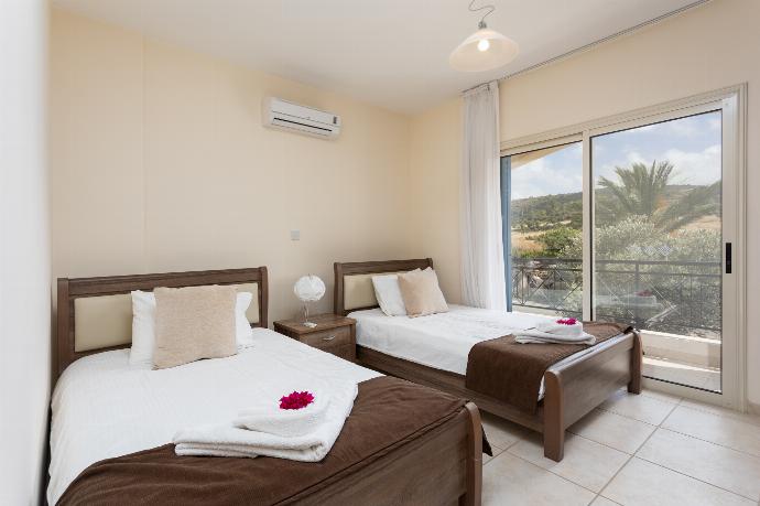 Twin bedroom with A/C and balcony access . - Villa Galina . (Photo Gallery) }}