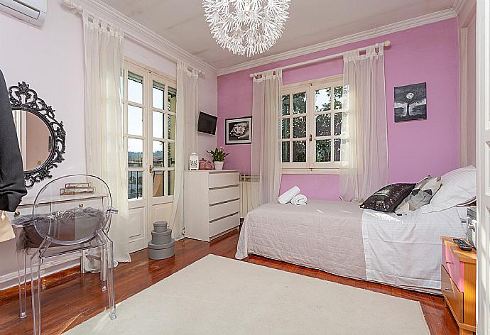 Single bedroom with A/C and balcony access . - Villa Durrell . (Photo Gallery) }}