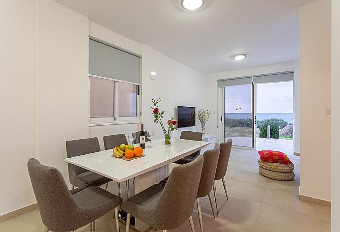 Open-plan living room with sofas, dining area, kitchen, A/C, WiFi internet, satellite TV, DVD player, panoramic sea views, and terrace access . - Villa Blue Diamond . (Galleria fotografica) }}